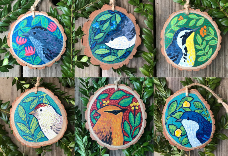 group of hand painted bird ornaments